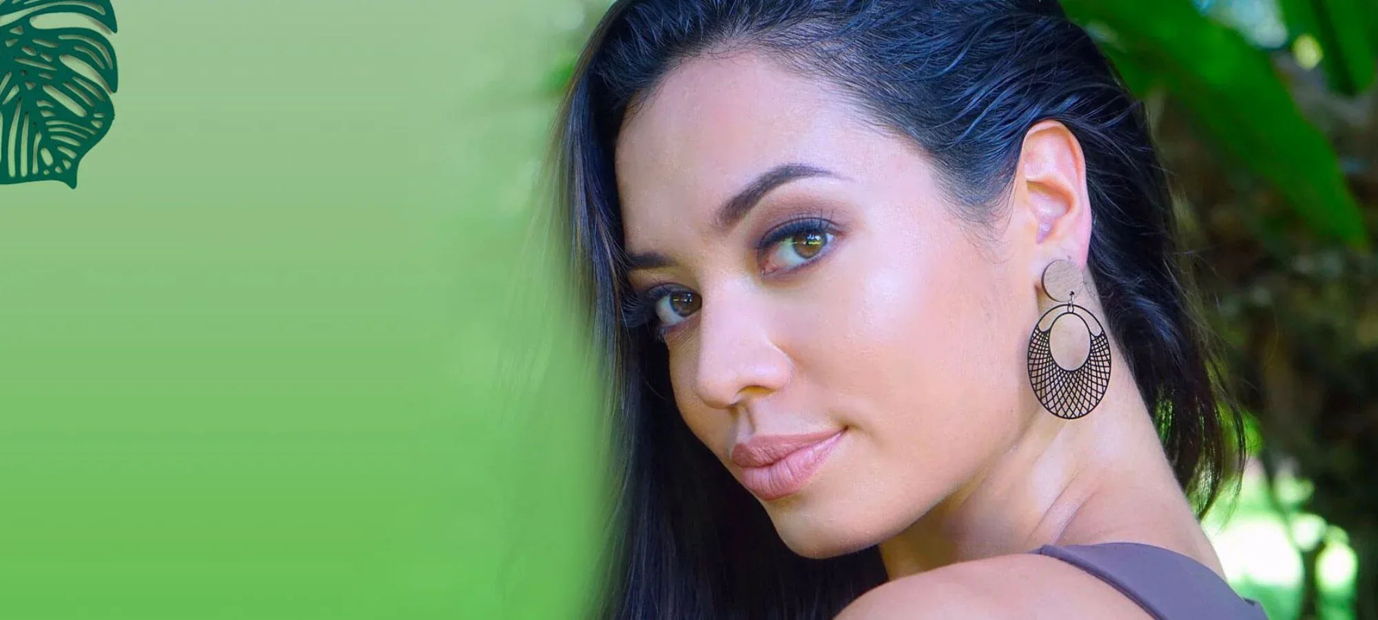 Model wearing black filigree statement earrings from Sunbaked Lizard Jewellery & Gifts