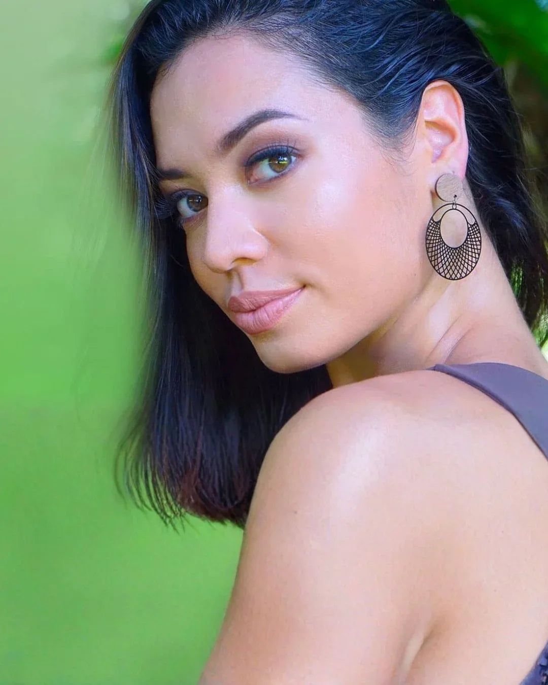 Model wearing black filigree statement earrings from Sunbaked Lizard Jewellery & Gifts