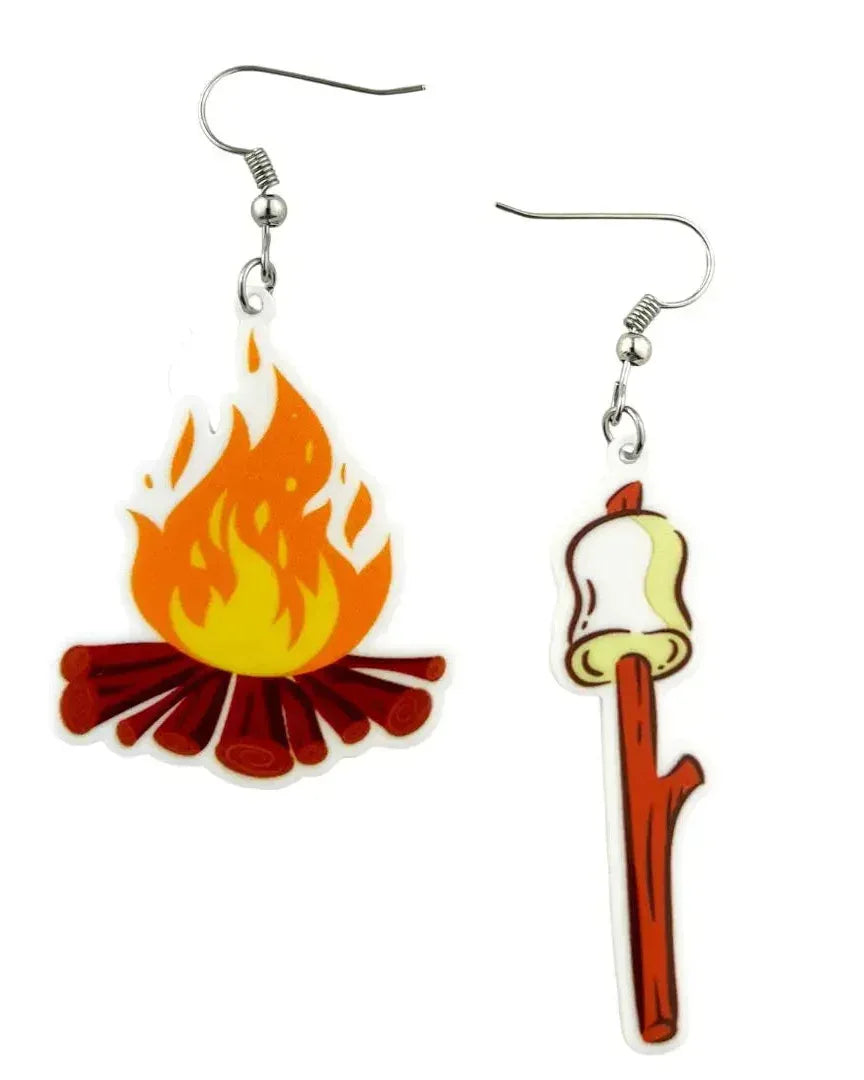 A pair of dangle earrings featuring a white marshmallow charm and a bright orange campfire flame on silver hooks.