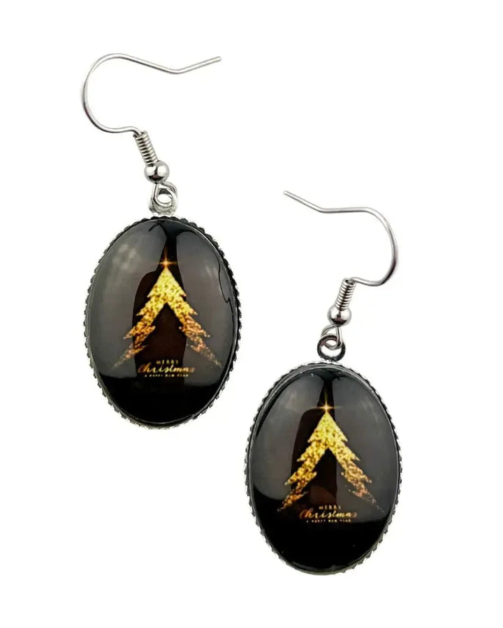 Merry Christmas tree earrings with a gold glitter tree on black and Merry Christmas in gold script, under domed oval glass