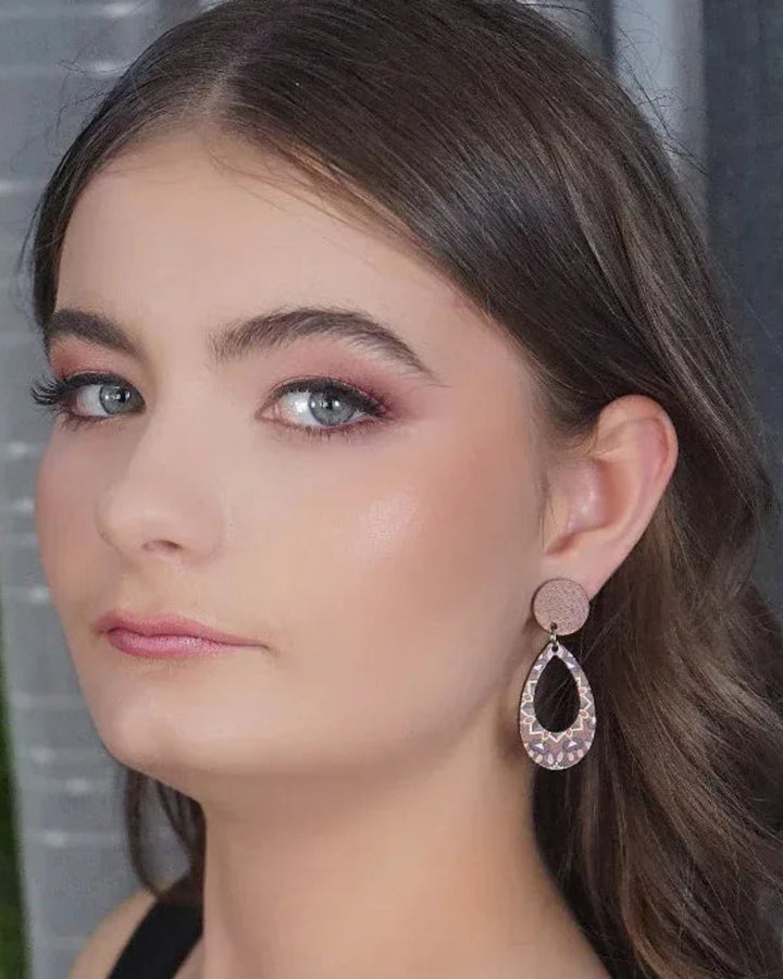 Model wearing pastel kaleidoscope timber oval drop earrings with brown timber