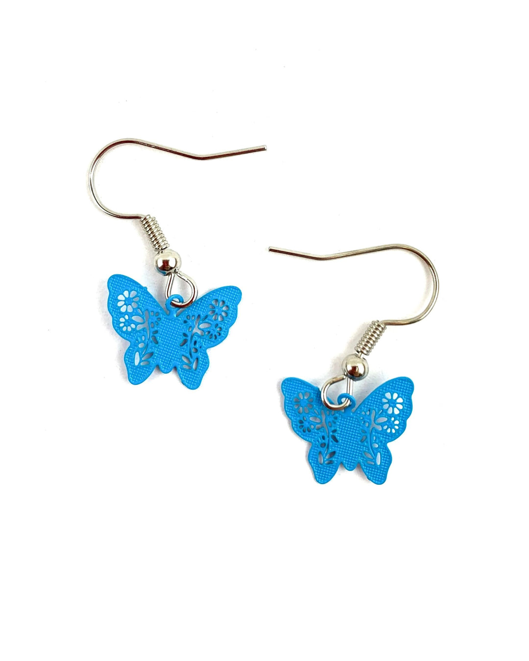 Petite blue filigree butterfly drop earrings with lightweight design and floral cut-out detail. Bright, joyful everyday jewellery by Sunbaked Lizard.