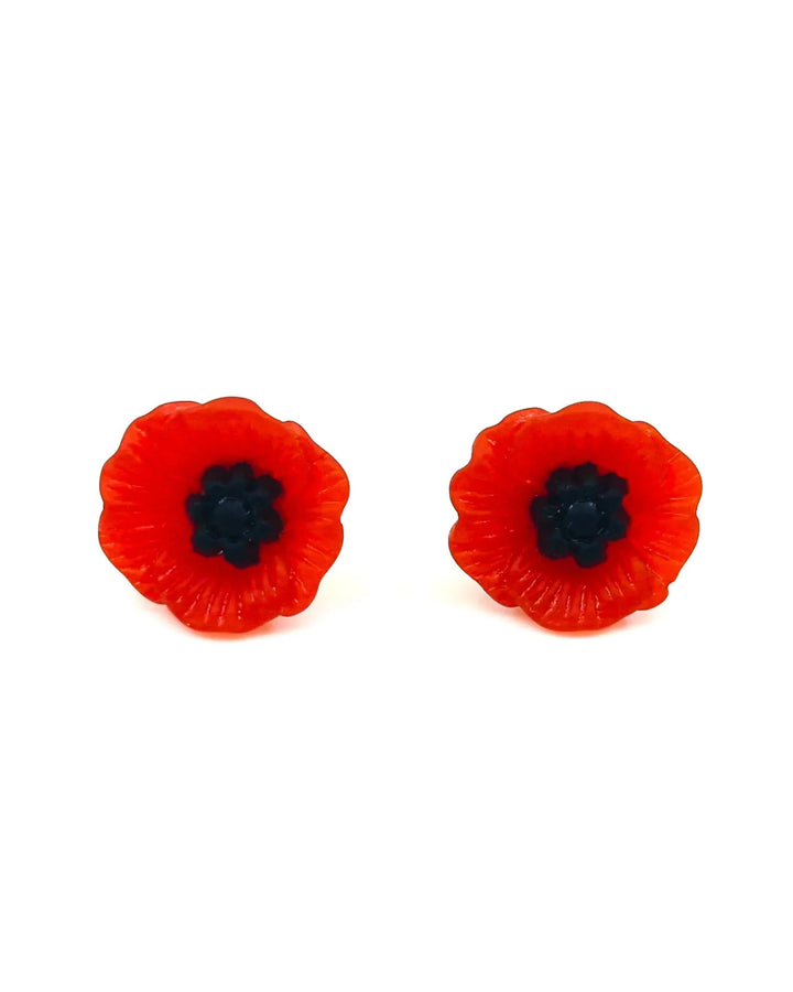 Petite red poppy stud earrings on white background