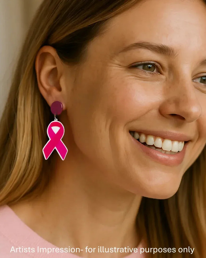 Model wearing pink ribbon stud drop earrings, showing the 60mm statement length