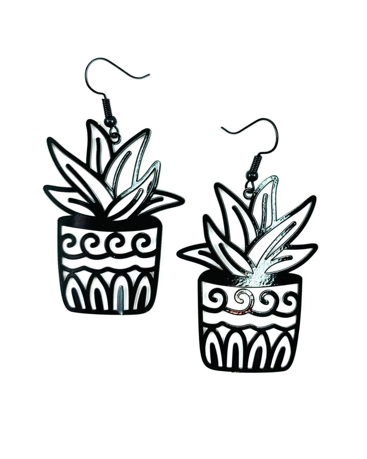 Black potted plant statement earrings with bold cut-out spiky leaves in a patterned pot
