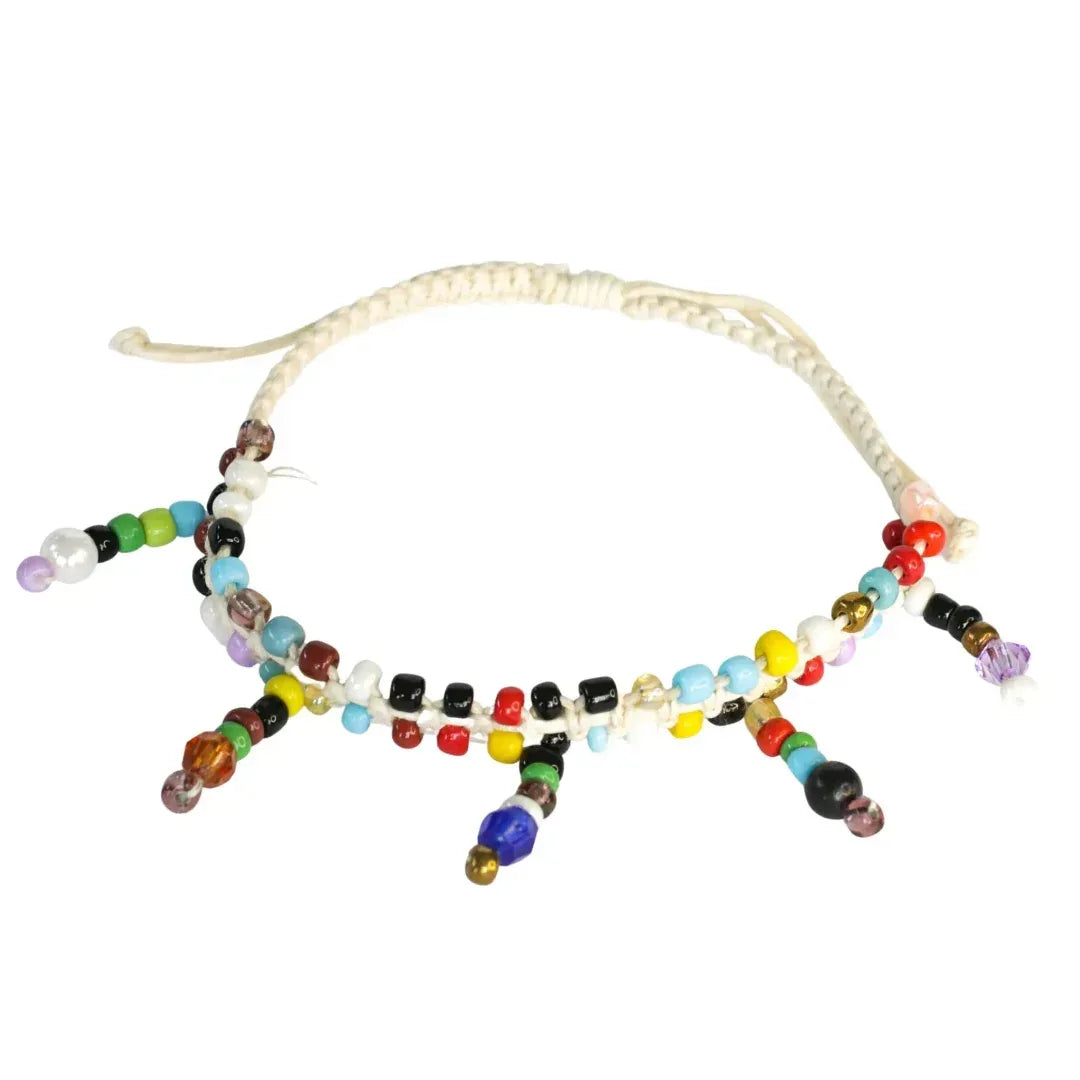 Close-up of Pride rainbow porcelain beads on adjustable beaded anklet