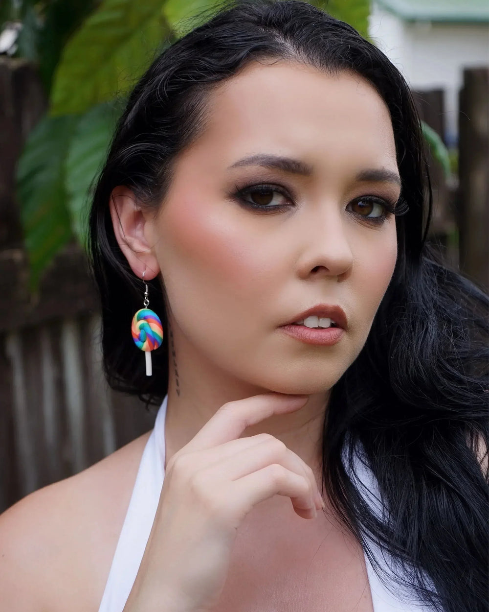 Rainbow lollipop earrings worn as bold statement earrings