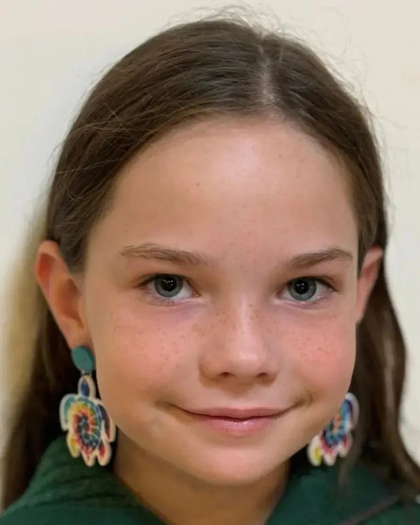 Model wearing rainbow tie dye turtle stud drop earrings