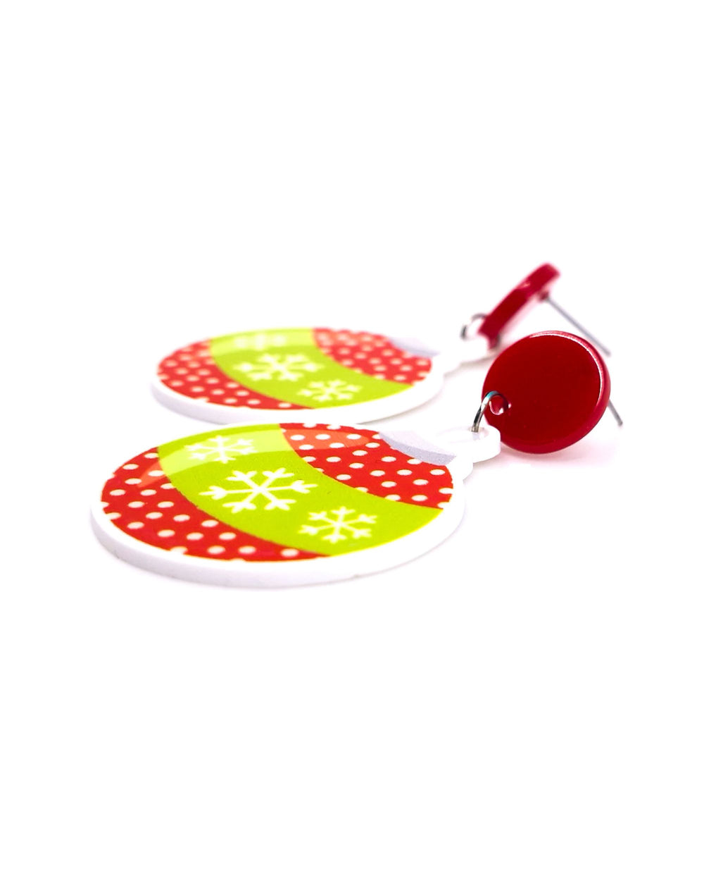Side view of red and green Christmas bauble earrings showing the flat acrylic charm and stainless steel post