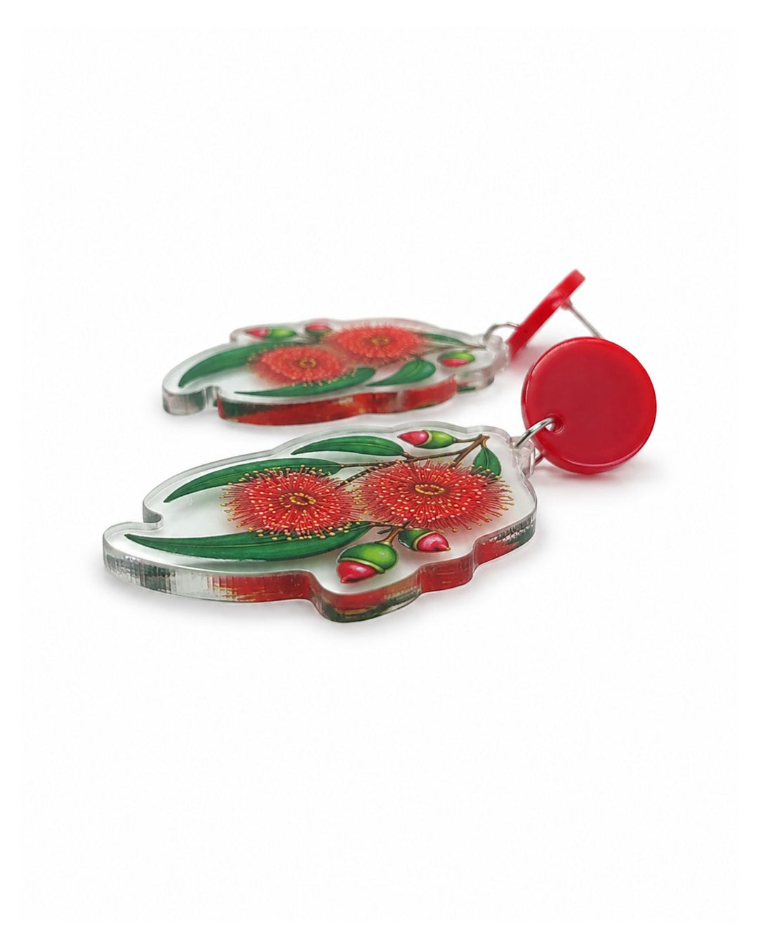 Side view of red gum blossom earrings showing the flat clear acrylic charm and the stud post