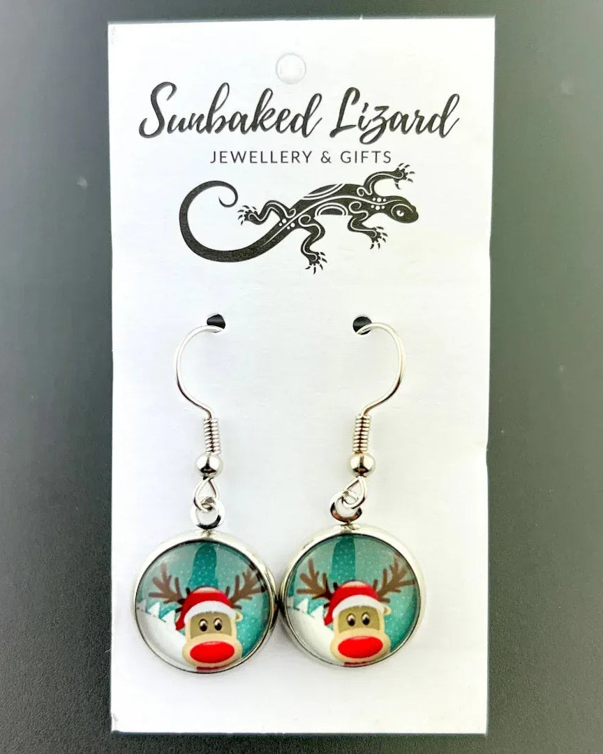 Red nose reindeer Christmas earrings on a Sunbaked Lizard backing card