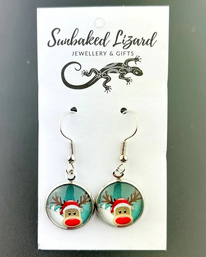 Red nose reindeer Christmas earrings on a Sunbaked Lizard backing card