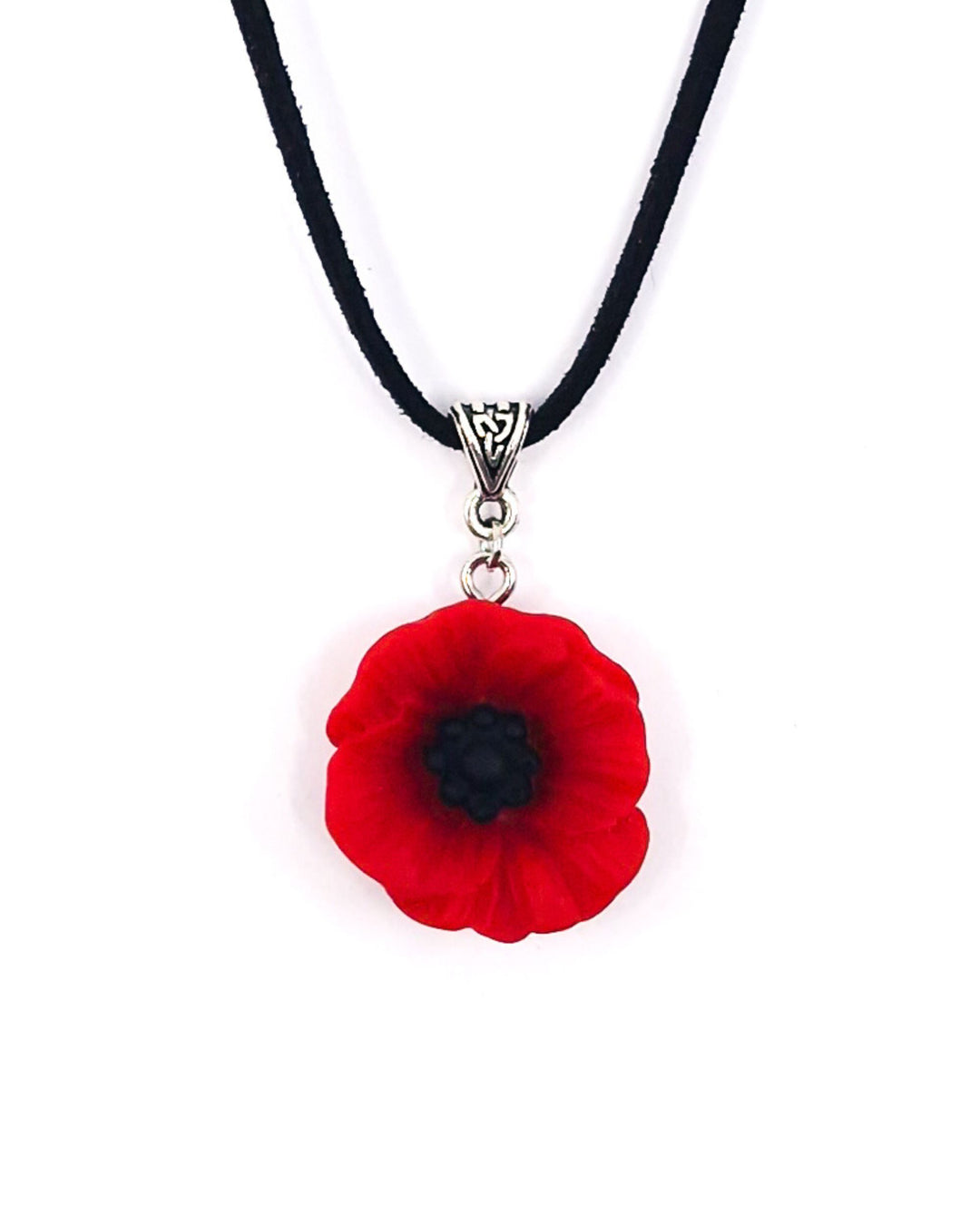 Red poppy necklace with black cord and silver bail on a white background