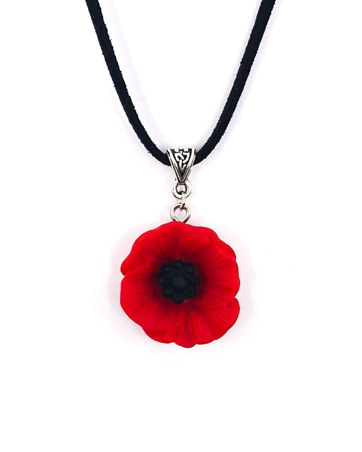 Red poppy necklace with black cord and silver bail on a white background