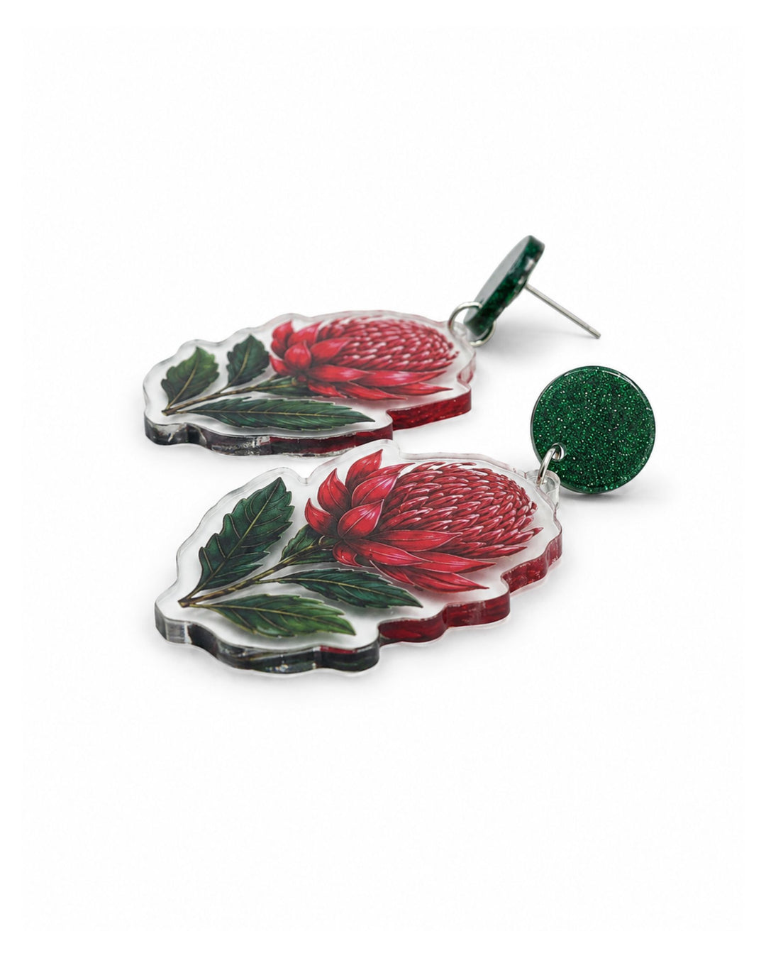 Side view of red waratah earrings showing the flat clear acrylic charm and the stud post