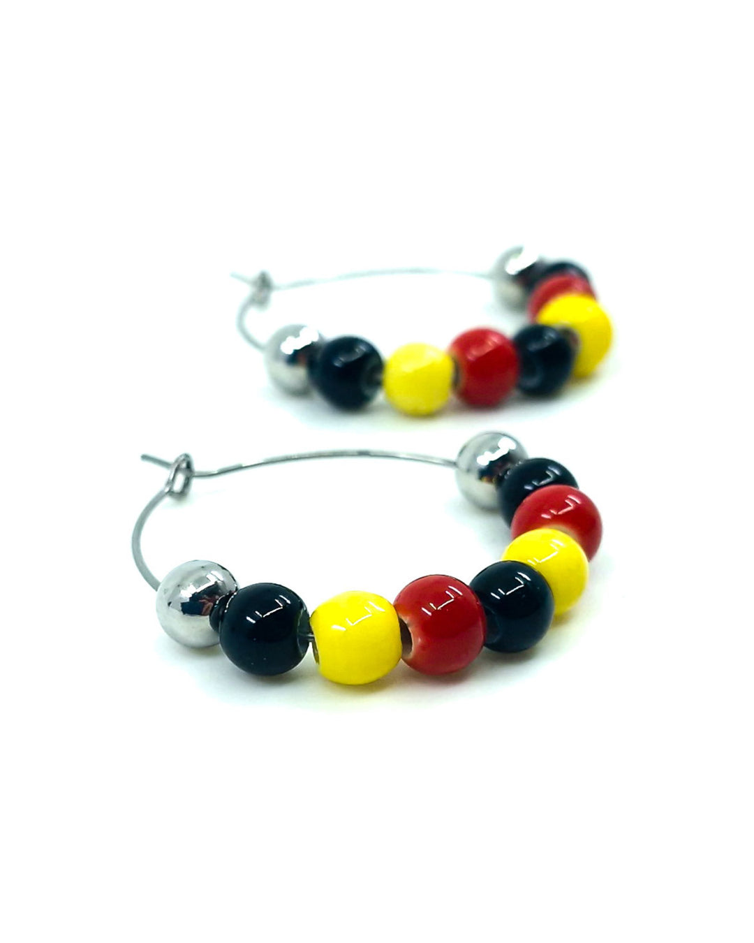 Red, yellow and black Indigenous inspired hoop earrings with glossy ceramic beads and silver metal beads