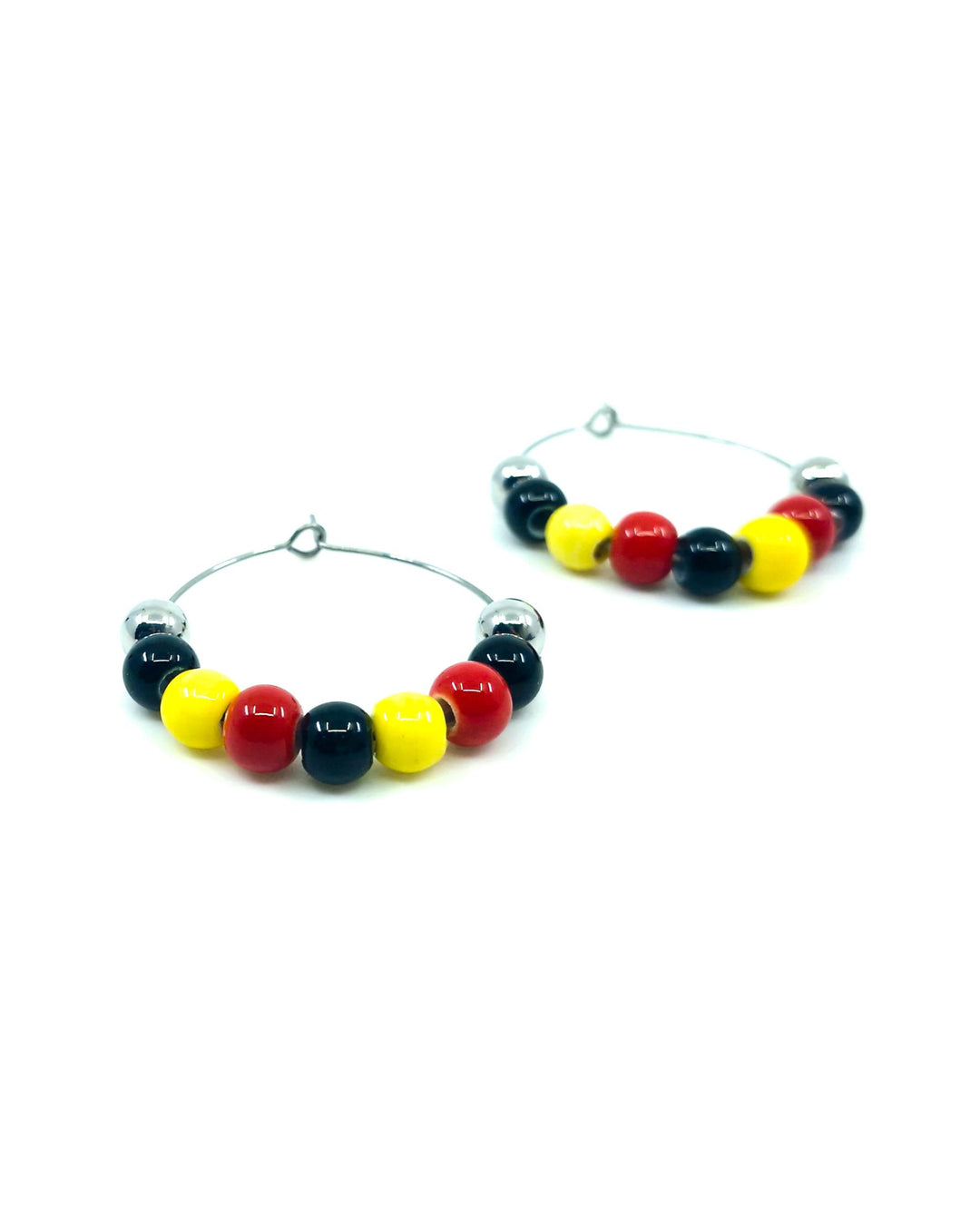 pair of red, yellow and black Indigenous inspired hoop earrings with glossy beads on silver hoops