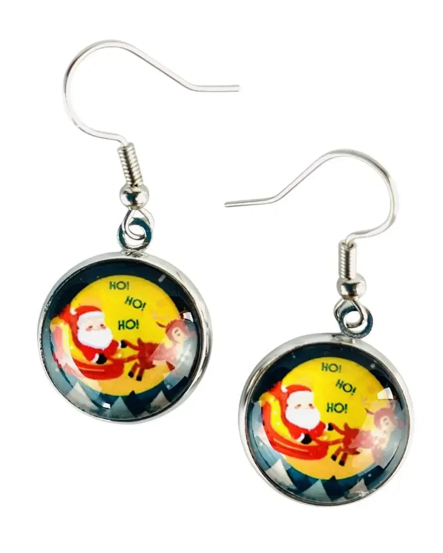 Santa in a sleigh Christmas earrings, a glass cabochon showing Santa and reindeer flying across a yellow moon