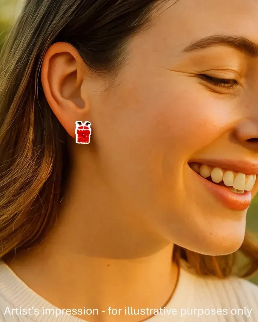 Model wearing a Santa in the chimney stud earring, showing the size against her ear