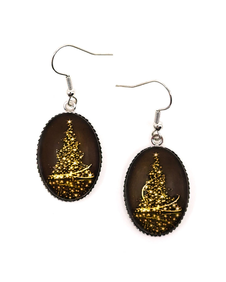 Shimmering Christmas tree earrings with a gold light tree on dark brown under domed oval glass