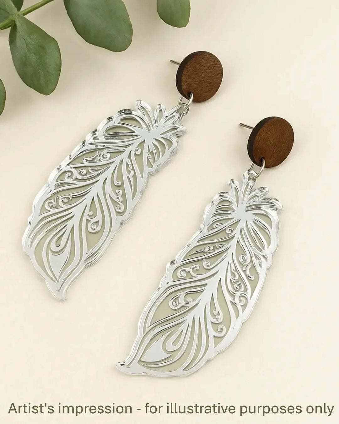 Intricately detailed feather earrings in silver with natural timber tops