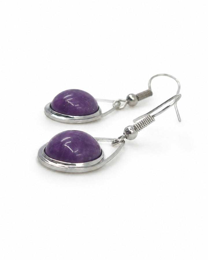 Side view of purple stone teardrop earrings showing the smooth domed stone face