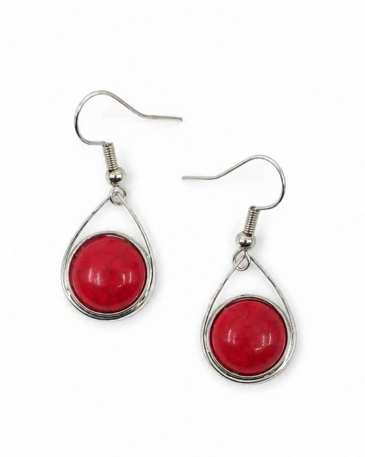 Red stone teardrop earrings with charcoal veining cracked through bright red domes