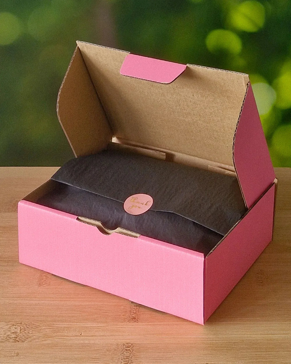 Sunbaked Lizard gift box open with wrapped tissue paper inside
