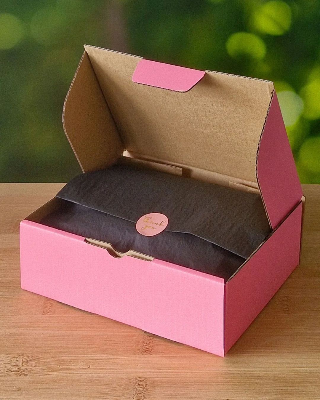Sunbaked Lizard gift box open with wrapped tissue paper inside