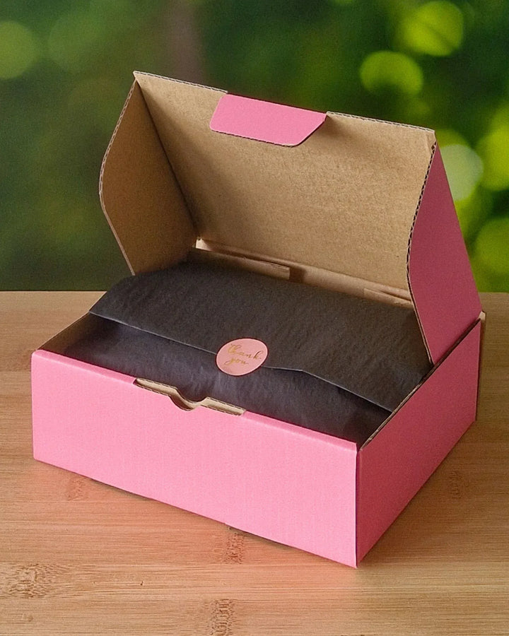 Sunbaked Lizard gift box open with wrapped tissue paper inside