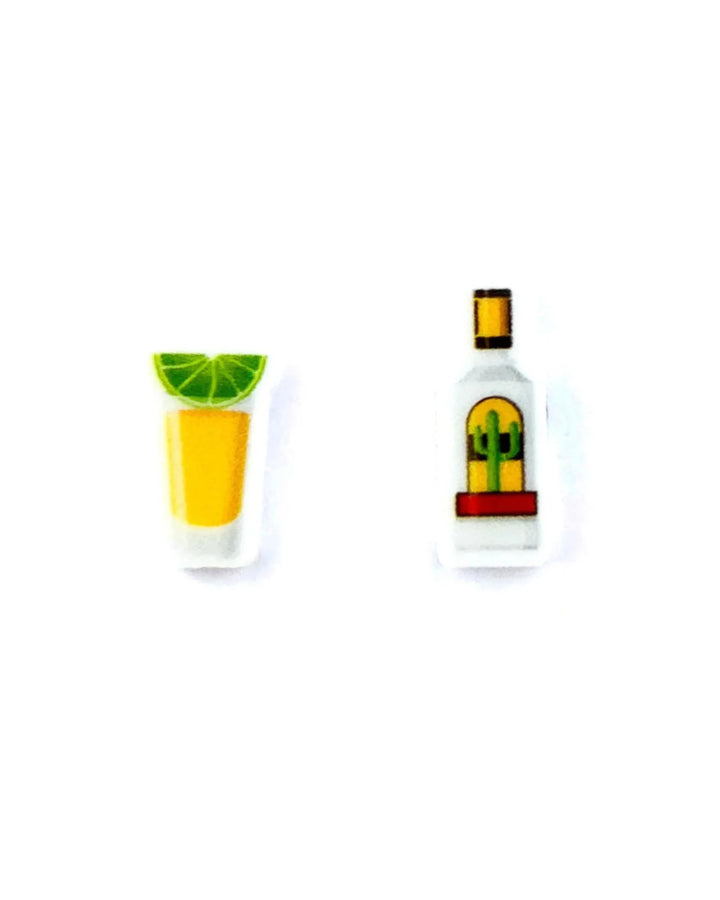 Tequila shot stud earrings featuring a tiny 2D acrylic bottle and shot glass with lime on a Sunbaked Lizard backing card