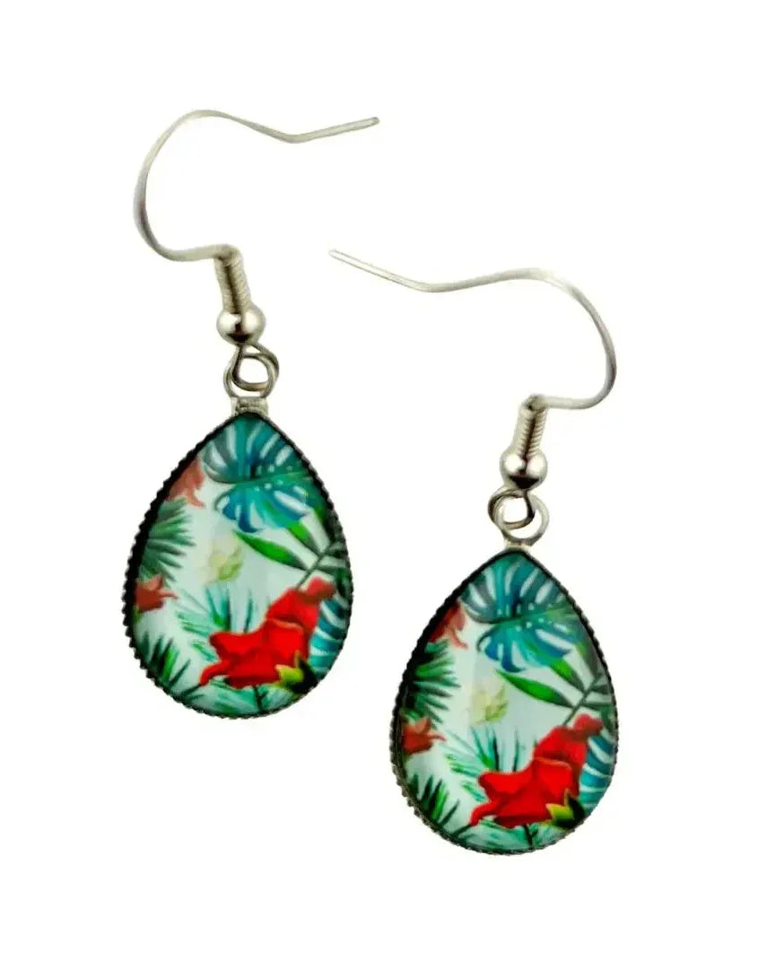 Close-up of tropical red flower cabochon teardrop earrings