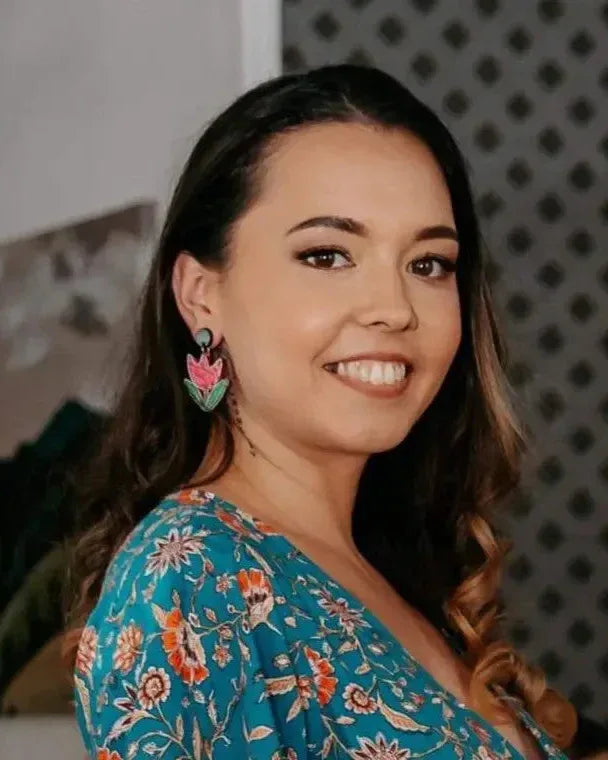 Woman wearing bold tulip statement drop earrings