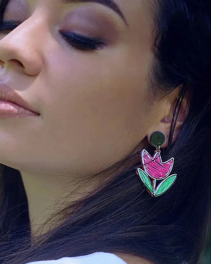 Pink tulip stud drop earrings with green leaves and black outline