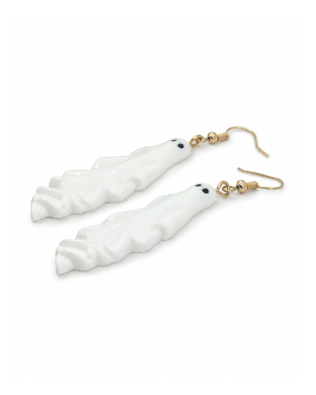 White ghost Halloween earrings with gold hooks, laid flat on white, showing floaty ghost charms with tiny black eyes