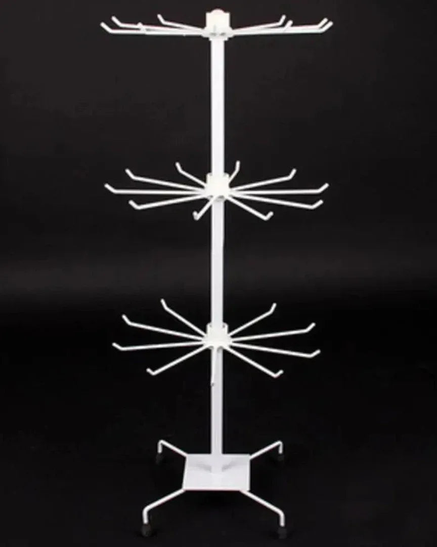 White freestanding multi-tier metal jewellery display stand with circular levels and hanging arms for earrings
