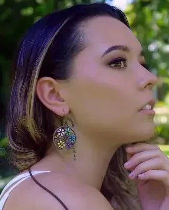 Model wearing copper floral earrings with a casual boho outfit