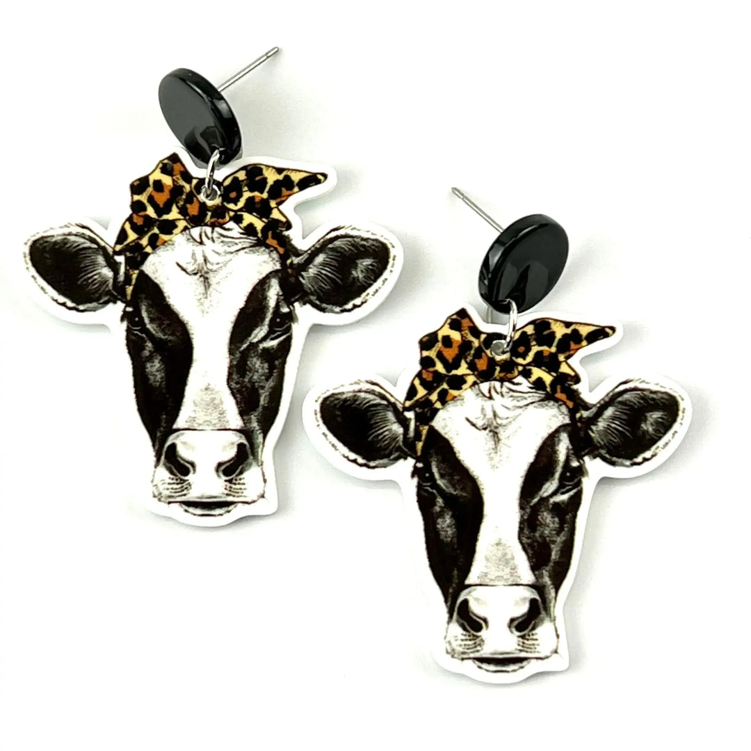 Black and white dairy cow stud drop earrings with leopard print bow and black round stud top