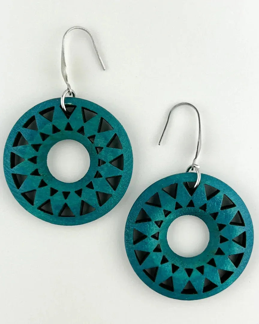 Dark teal timber sun earrings with triangle cut-out sunburst design on silver hook findings