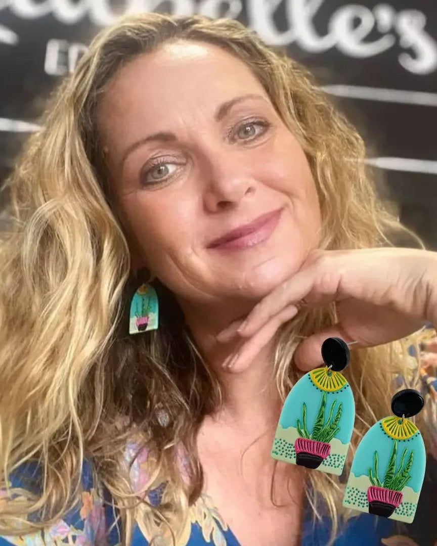 Bold cactus plant earrings worn for a creative, botanical look