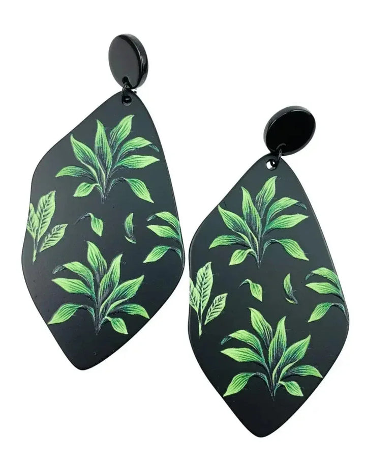 Fern tropical plant drop earrings product photo on white background