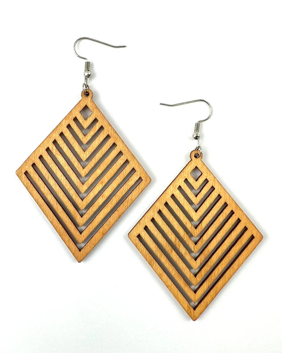 Alt text: Pair of Izzy diamond shaped geometric timber drop earrings with layered chevron cut-outs on white background