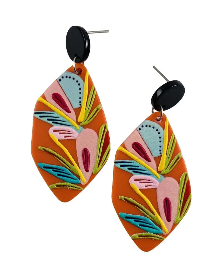 Orange tropical plant dangle earrings with raised colourful botanical design and black stud tops