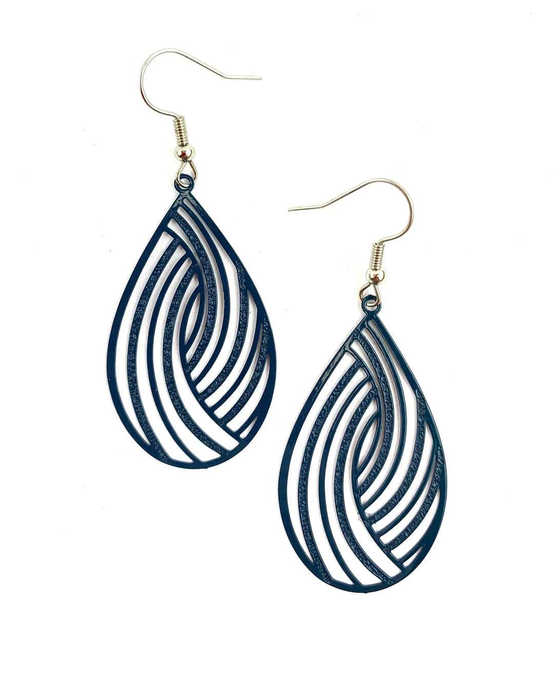 Pair of navy blue swirl cut-out teardrop dangle earrings with curved cut-out pattern and silver hooks