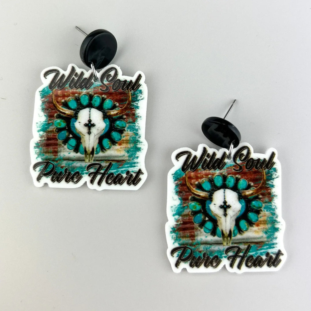 Wild Soul Pure Heart statement drop earrings featuring turquoise longhorn skull design with black stud top